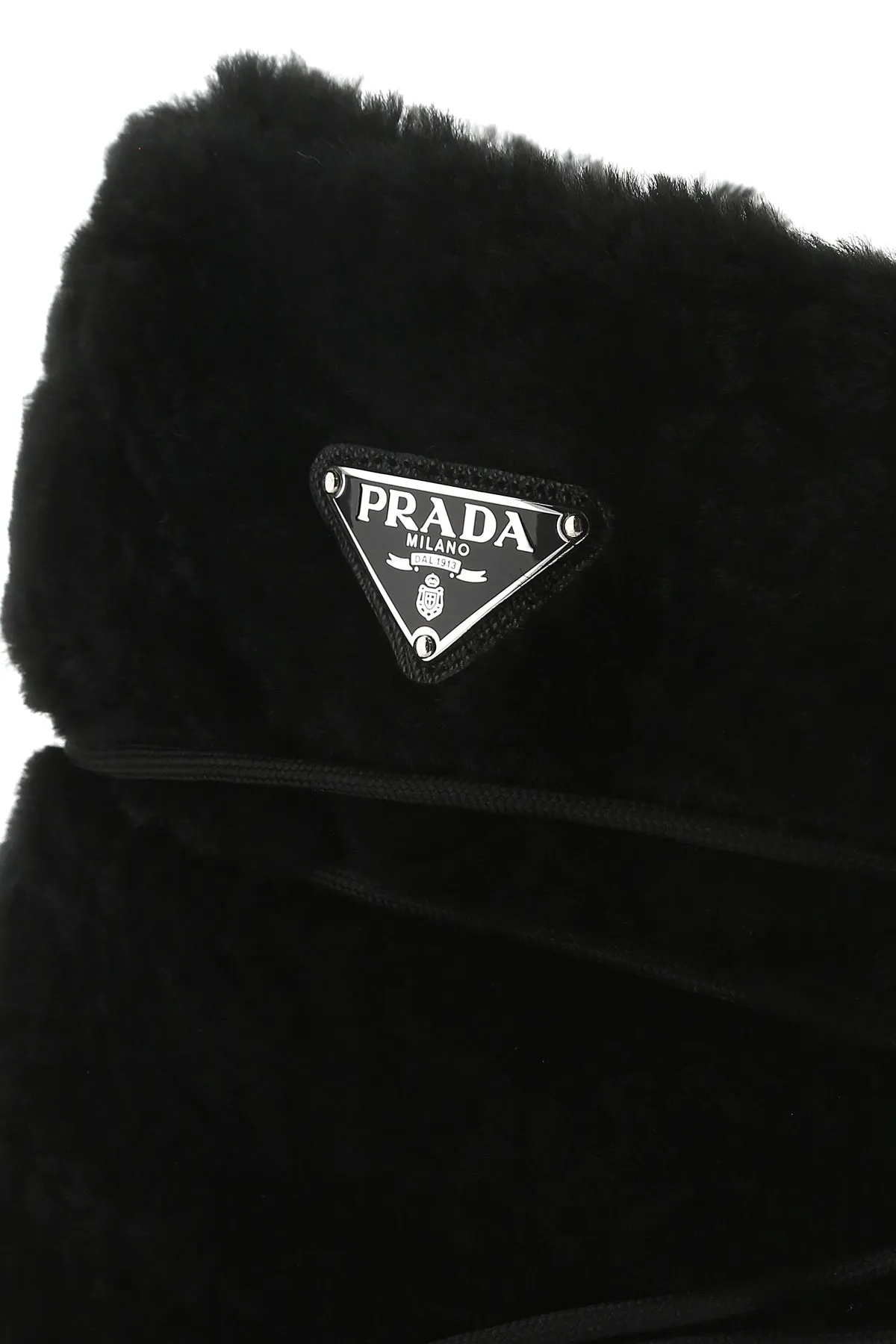 Black shearling and rubber ankle boots